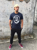 navy blue tee with whit logo print on front, black cuff pants. That_kiwi streetwear.